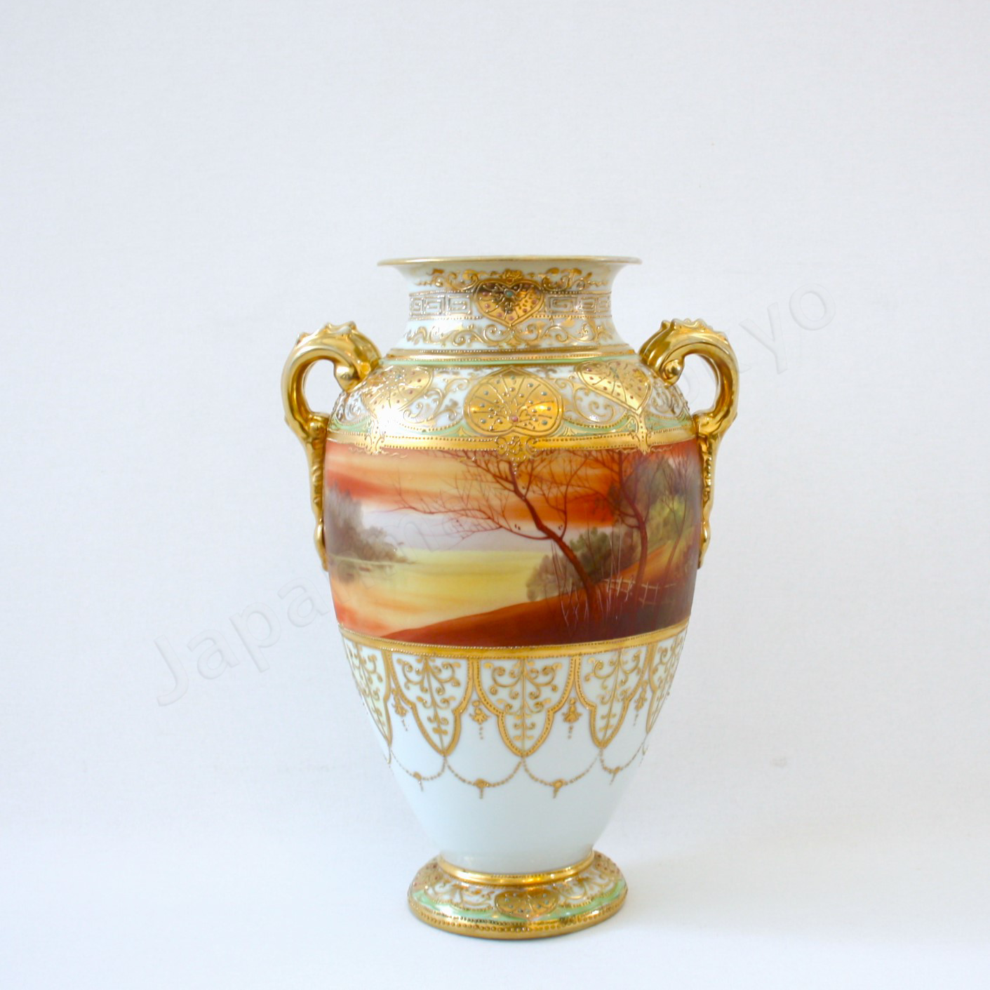 Front view: Japanese old fine china. Old Noritake. Vase with handles
Galle landscape design
polychrome and gold.