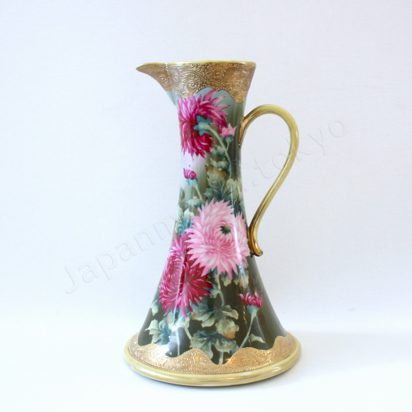 Front view: Japanese old fine china. Old Noritake. Water Picher with handles
Chrysanthemum design
polychrome and gold.