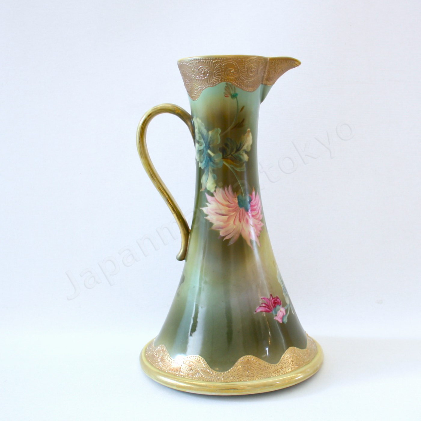 Back view: Japanese old fine china. Old Noritake. Water Picher with handles
Chrysanthemum design
polychrome and gold.