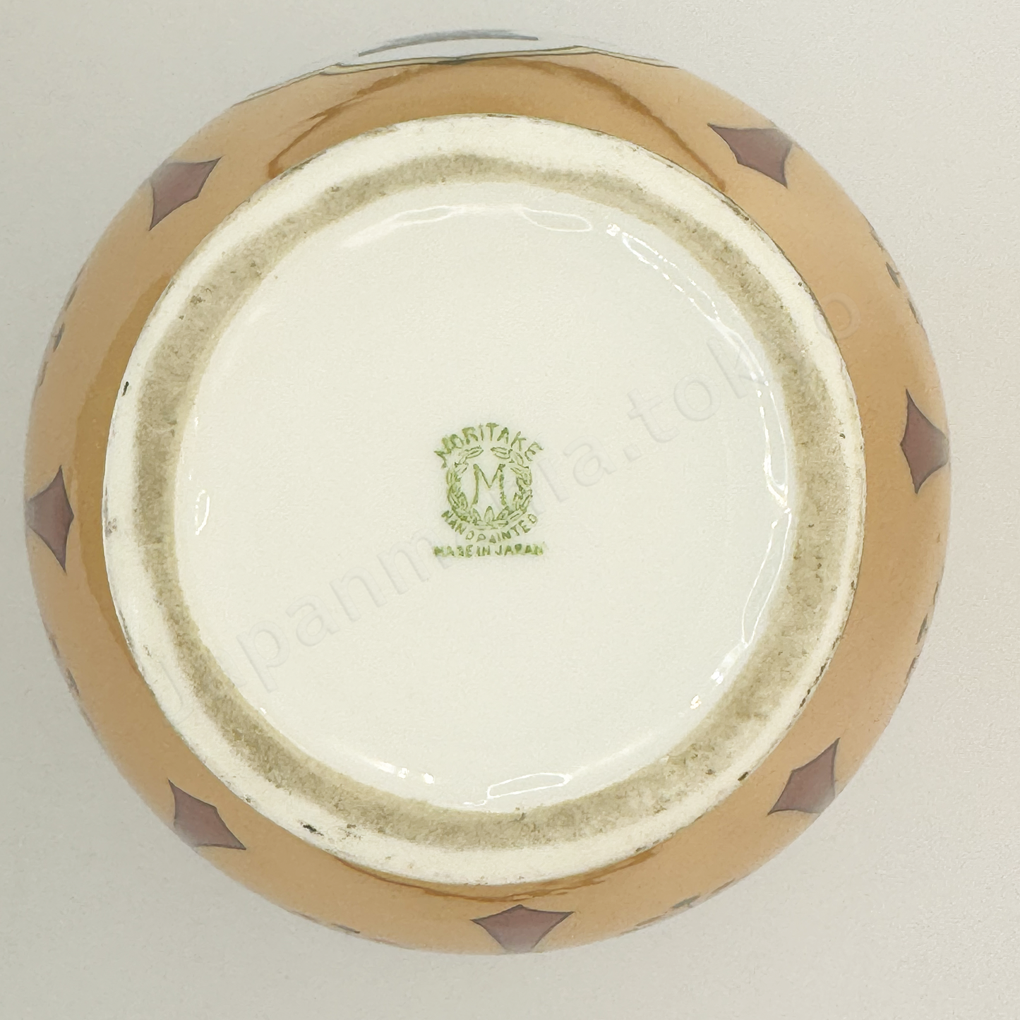 Back stamps: Noritake M in Wreath
The Old Noritake EB-1124 Vase, showcasing its elegant Art Deco style with a flower basket design and a shimmering polychrome luster finish.