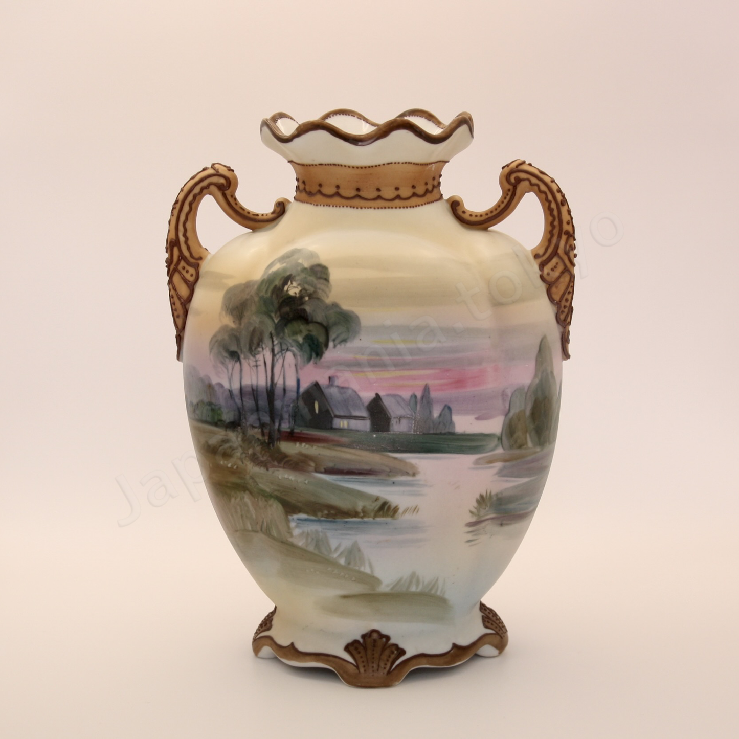 Front view: Japanese old fine china. Old Noritake.
Ruffle top vase with handles
Landscape design
Polychrome
