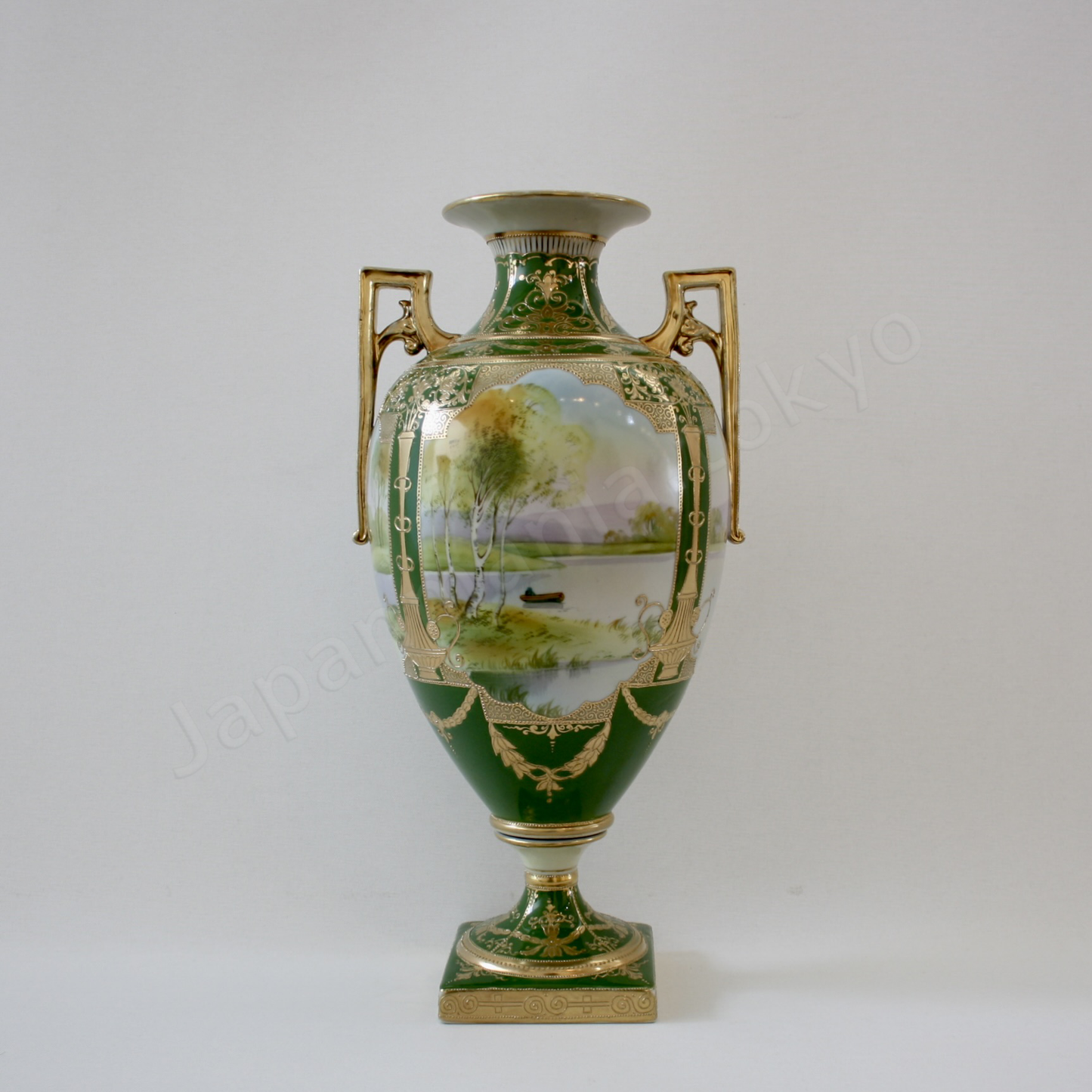 Front view: Japanese old fine china. Old Noritake.
Decorated Bolted Urn with handles
Lakeside Landscape design
Polychrome and gold