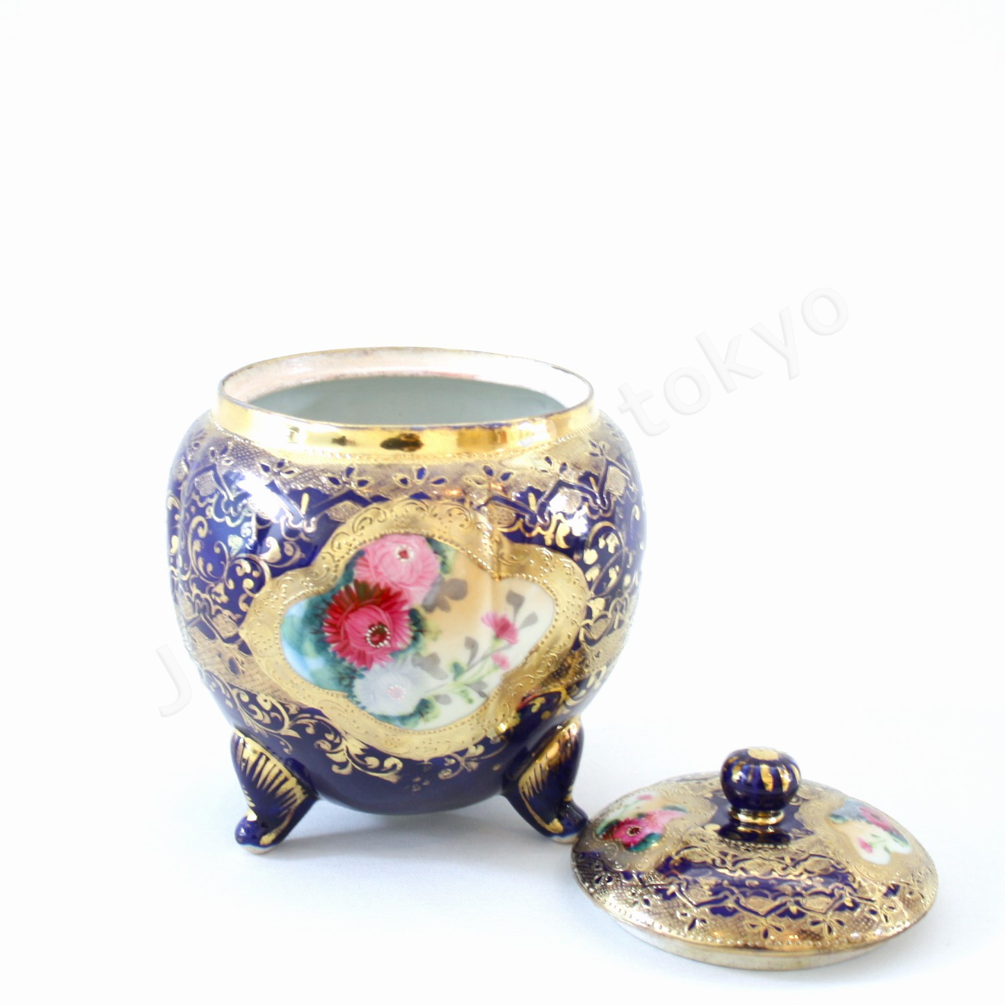 Front view: Japanese old fine china. Old Noritake.
Footed cookie jar with Chrysanthemum design
cobalt blue and gold relief