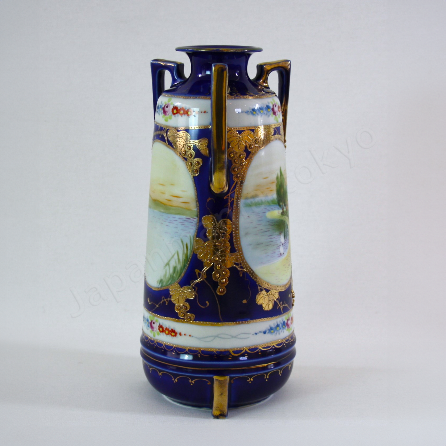 Side view: Japanese antique fine china. Old Noritake.
Vase with handles
Lakeside landscape design
Polychrome, gold and cobalt blue
