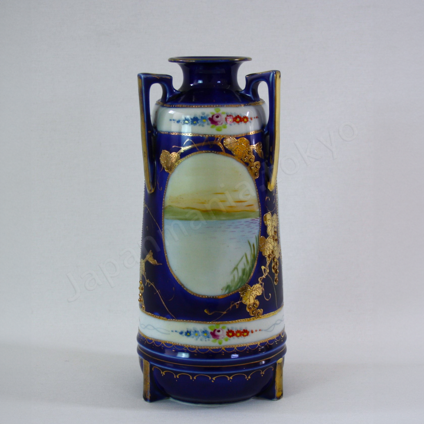 Back view:Japanese antique fine china. Old Noritake.
Vase with handles
Lakeside landscape design
Polychrome, gold and cobalt blue