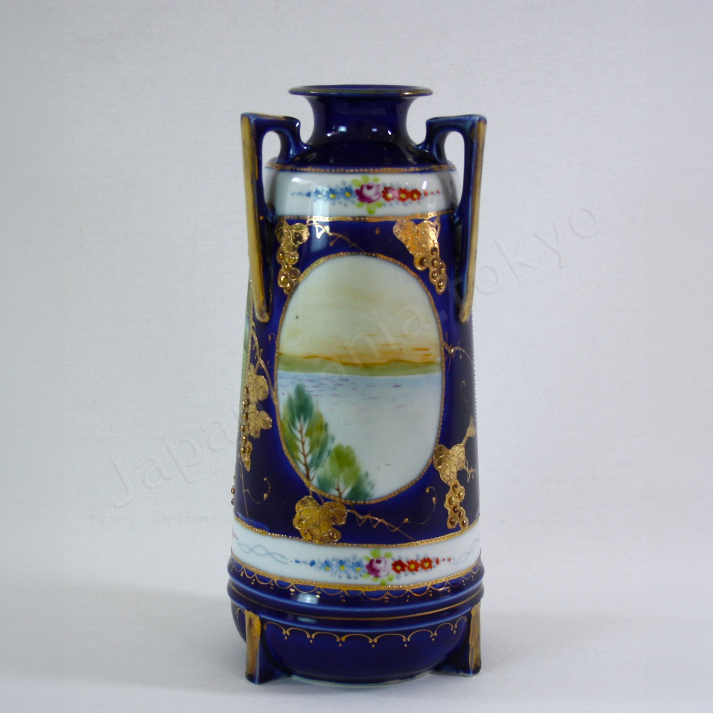 Back view:Japanese antique fine china. Old Noritake.
Vase with handles
Lakeside landscape design
Polychrome, gold and cobalt blue
