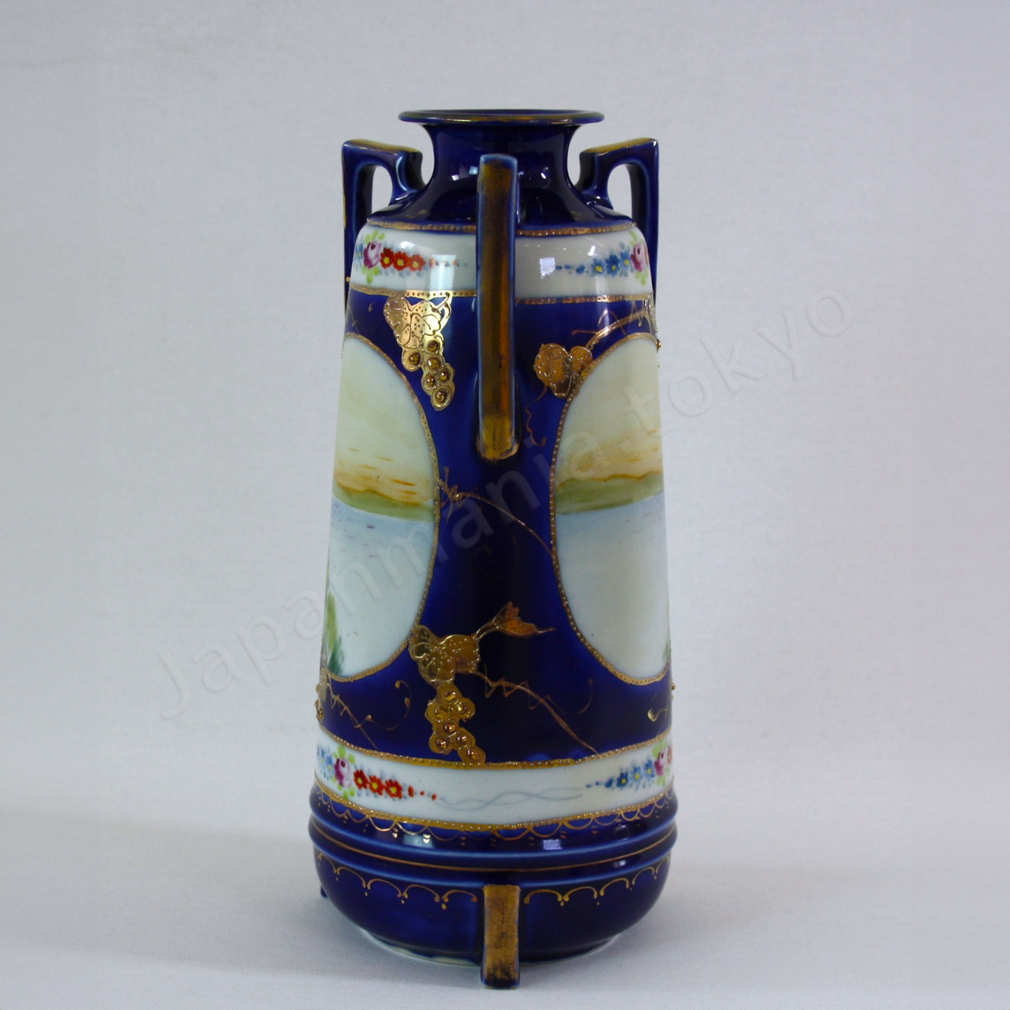 Side view: Japanese antique fine china. Old Noritake.
Vase with handles
Lakeside landscape design
Polychrome, gold and cobalt blue