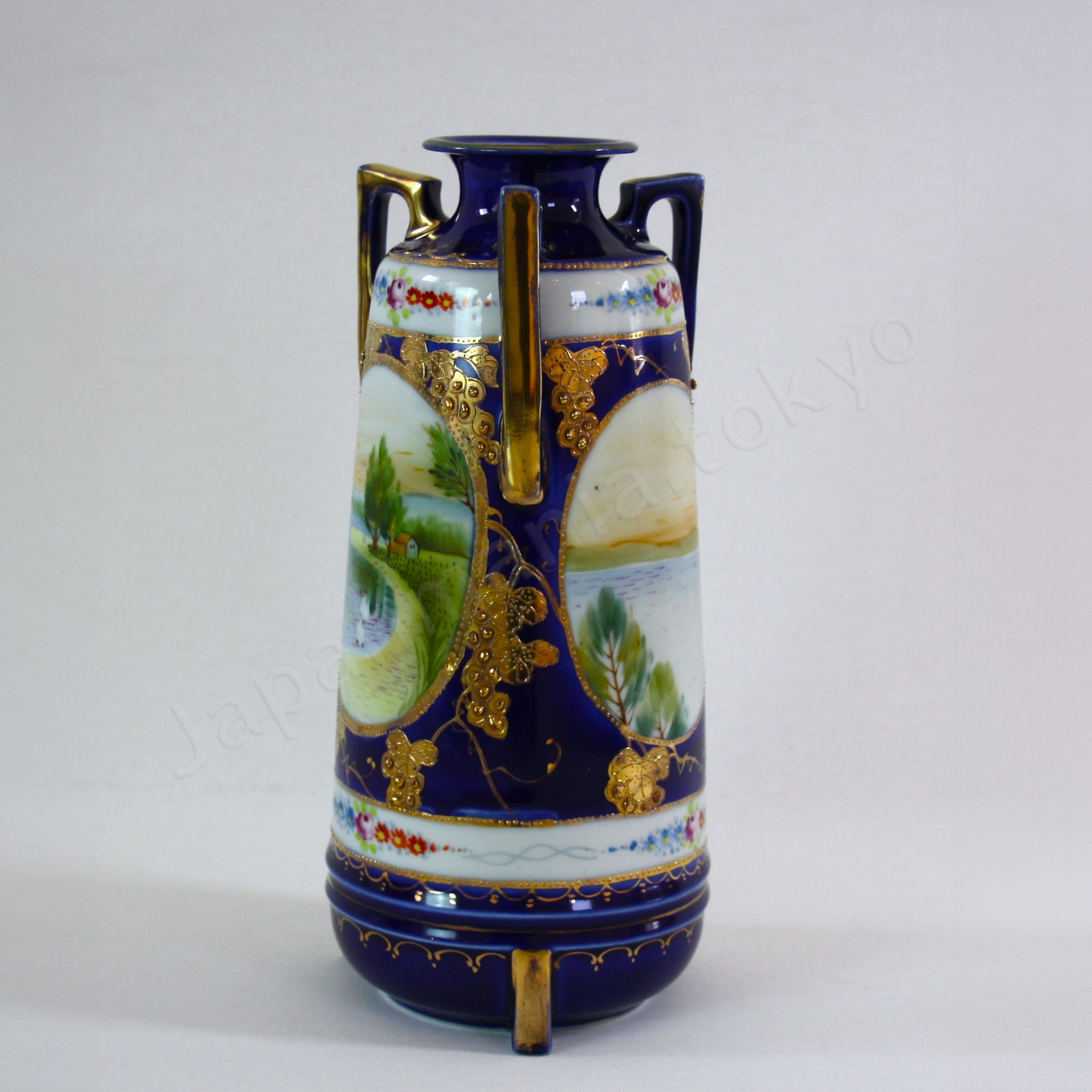 Side view:Japanese antique fine china. Old Noritake.
Vase with handles
Lakeside landscape design
Polychrome, gold and cobalt blue