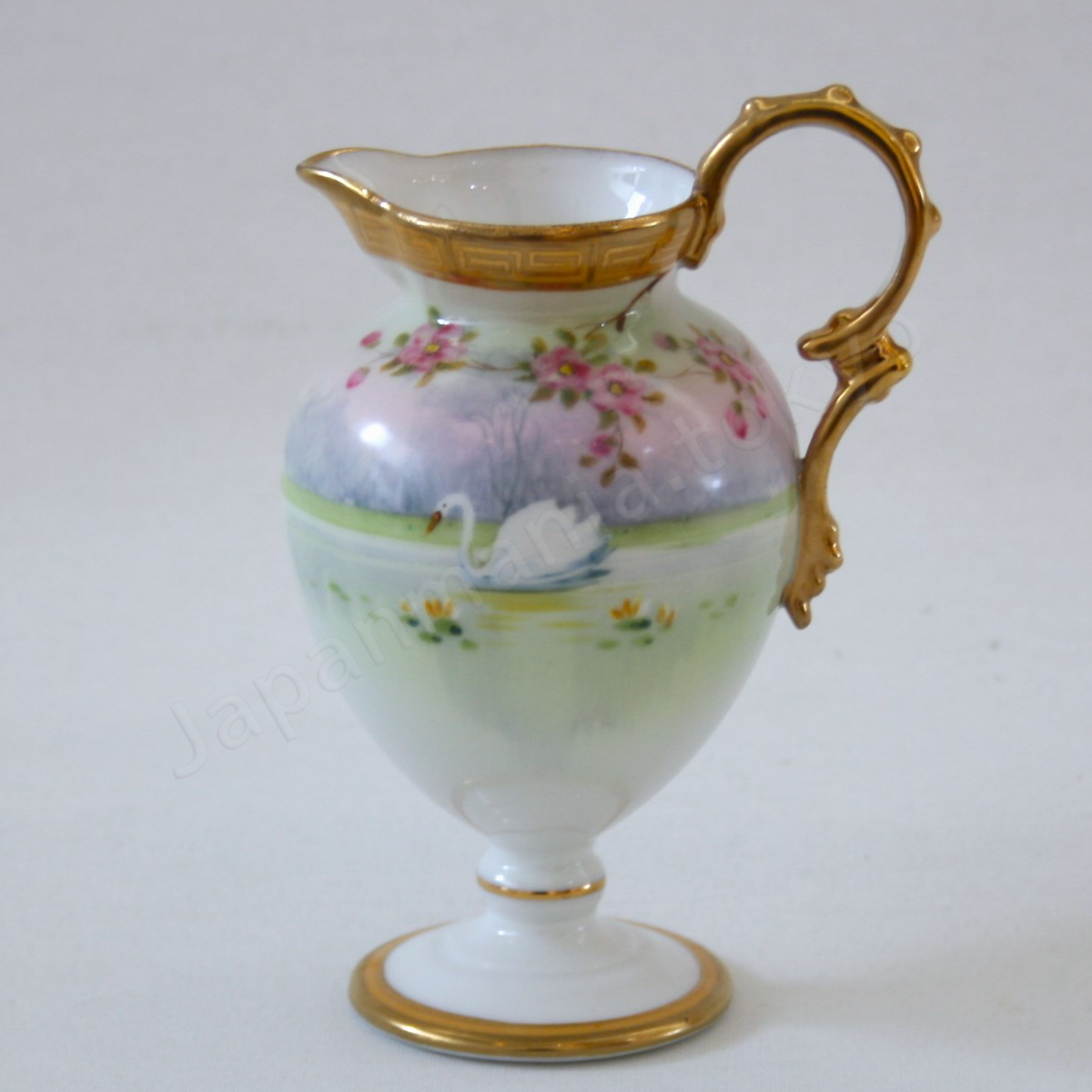 Front view: Japanese Antique fine china. Old Noritake.
Tea set
Swan and landscape design
Polychrome and gold