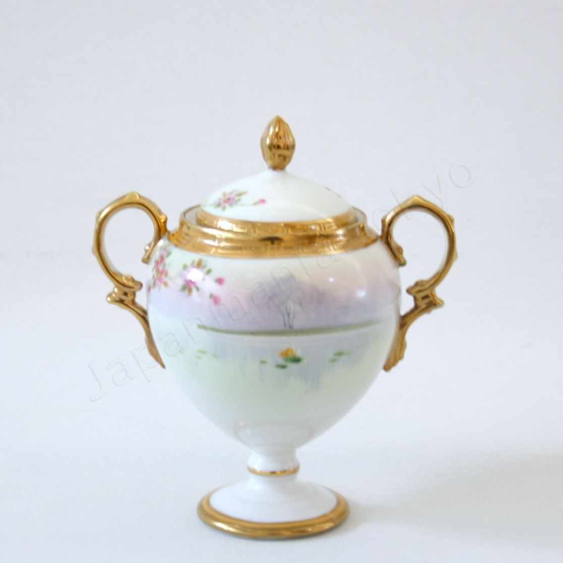 Back view: Japanese Antique fine china. Old Noritake.
Tea set
Swan and landscape design
Polychrome and gold