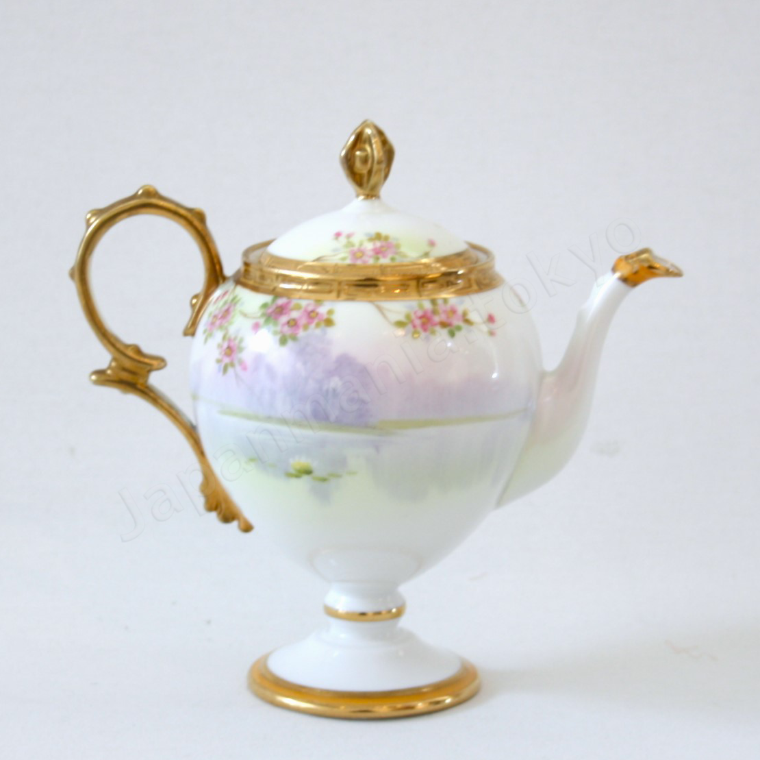 Back view: Japanese Antique fine china. Old Noritake.
Tea set
Swan and landscape design
Polychrome and gold