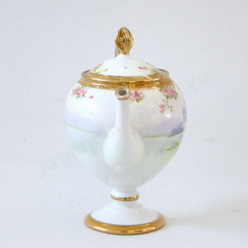 Side view: Japanese Antique fine china. Old Noritake.
Tea set
Swan and landscape design
Polychrome and gold