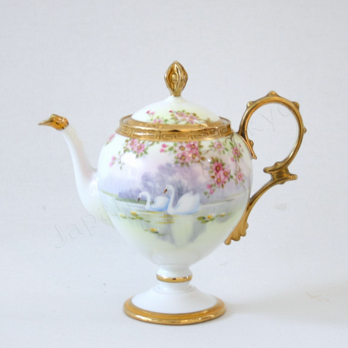 Front view:Japanese Antique fine china. Old Noritake.
Tea set
Swan and landscape design
Polychrome and gold