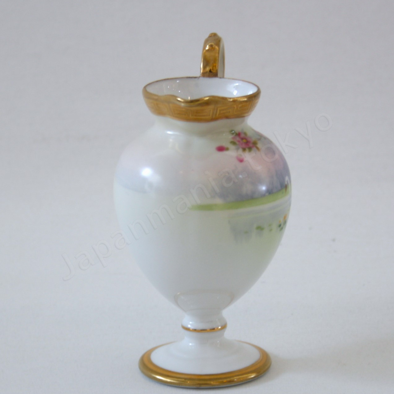 Side view: Japanese Antique fine china. Old Noritake.
Tea set
Swan and landscape design
Polychrome and gold