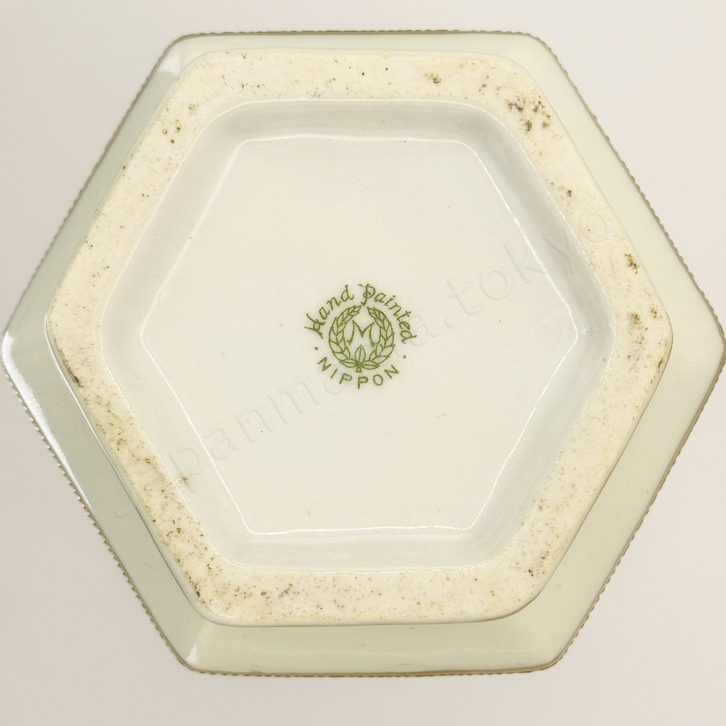 Back stamps: M in Wreath
Japanese antique fine china. Old Noritake, featuring castle ruins framed within floral motifs and bordered with gold accents on the top, bottom, and handles.