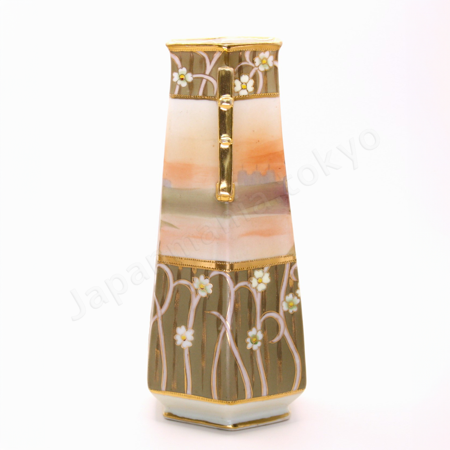 Side view: Japanese antique fine china. Old Noritake, featuring castle ruins framed within floral motifs and bordered with gold accents on the top, bottom, and handles.