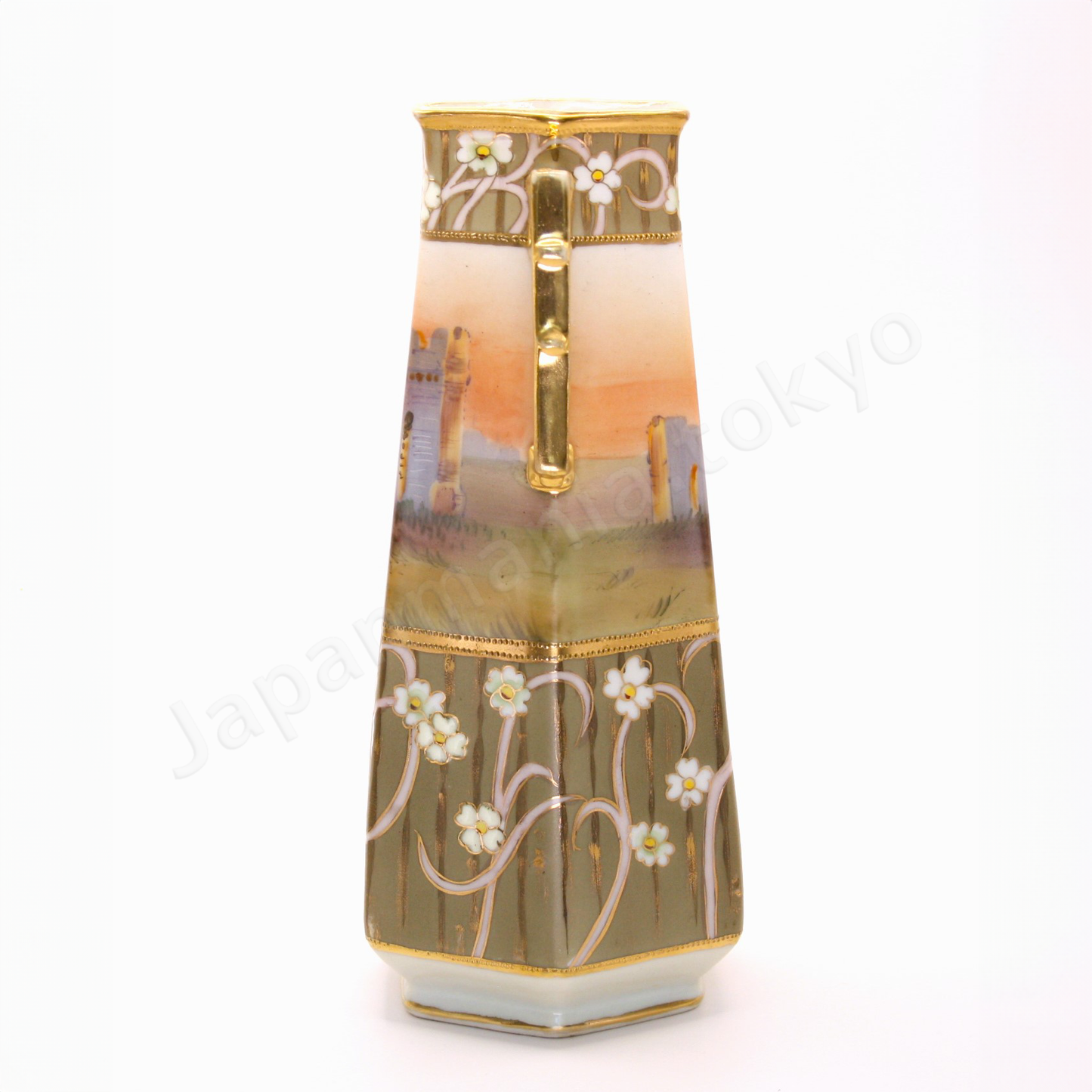 Side view: Japanese antique fine china. Old Noritake, featuring castle ruins framed within floral motifs and bordered with gold accents on the top, bottom, and handles.