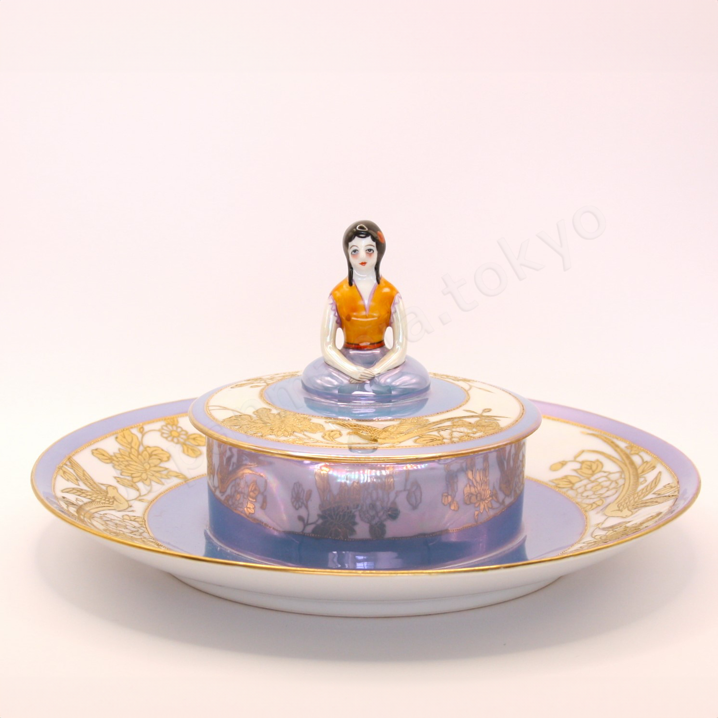 Front view: Japanese antique fine china. Old Noritake, Dip Dish, showcasing its unique Art Deco style and a lady-shaped lid with vibrant floral motifs and a beautiful polychrome luster finish.