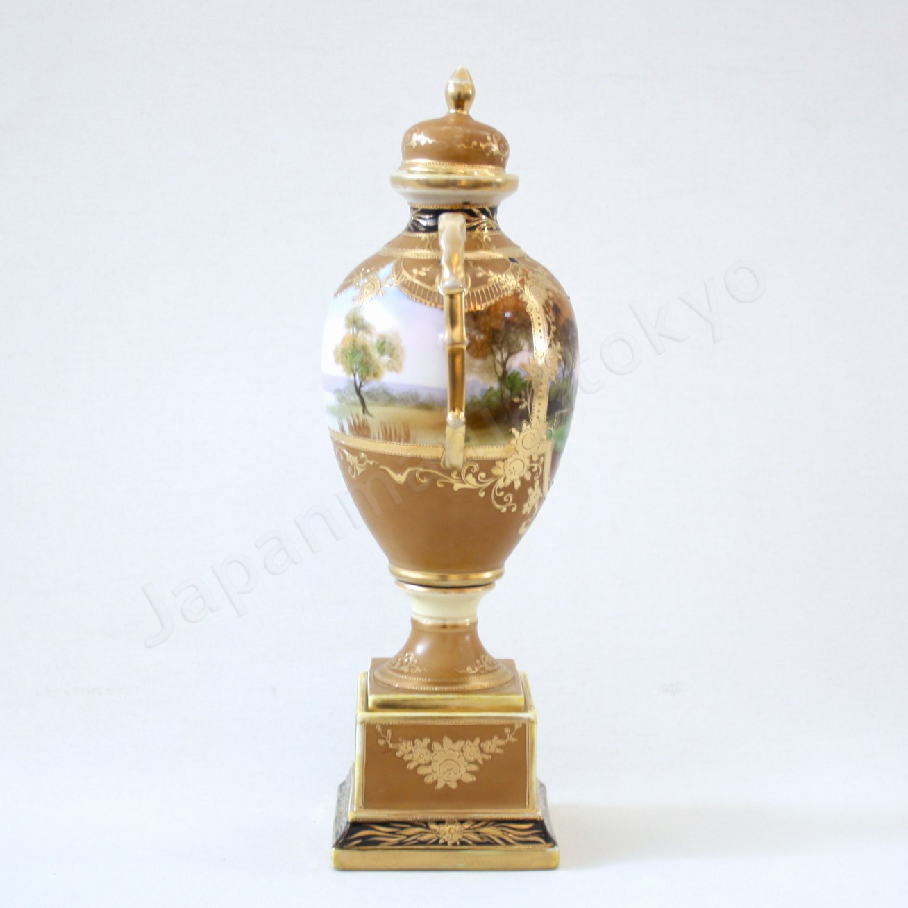 Side view: Japanese antique fine china, Old Noritake.
Bolted urn with lid & handles
Landscape design
polychrome and gold