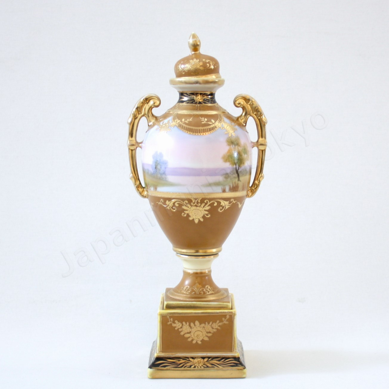 Back view: Japanese antique fine china, Old Noritake.
Bolted urn with lid & handles
Landscape design
polychrome and gold
