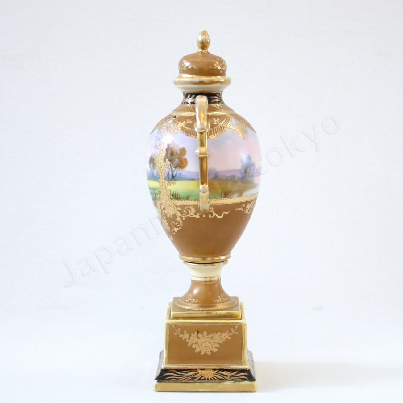Side view: Japanese antique fine china, Old Noritake.
Bolted urn with lid & handles
Landscape design
polychrome and gold