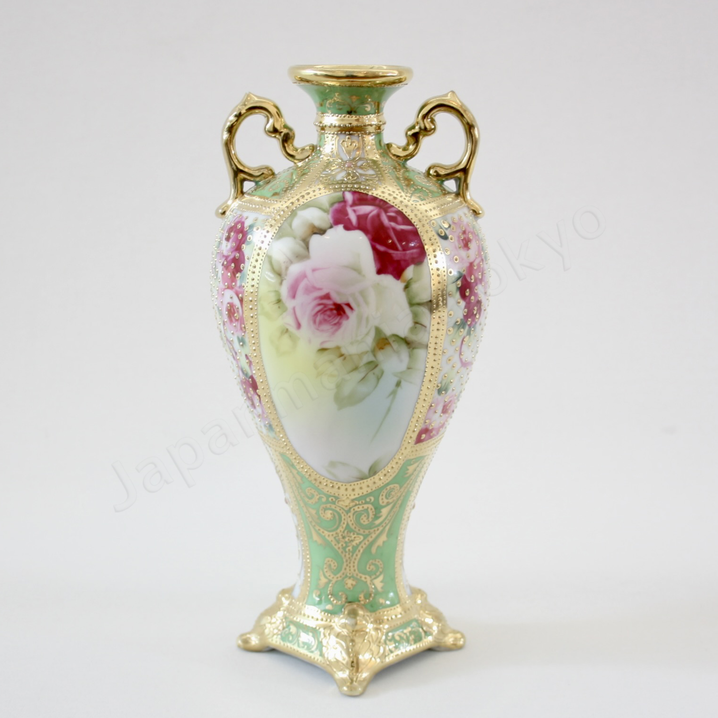 Front view: Japanese antique fine china, Old Noritake.
Decorated pot with handles
Rose design
Polychrome and dotted gold relief