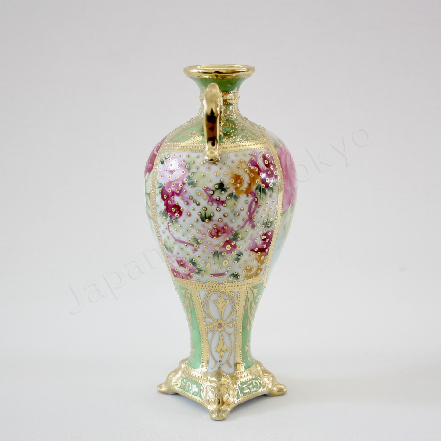 Side view: Japanese antique fine china, Old Noritake.
Decorated pot with handles
Rose design
Polychrome and dotted gold relief