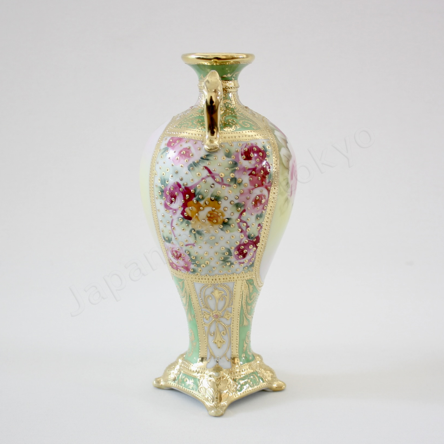 Side view: Japanese antique fine china, Old Noritake.
Decorated pot with handles
Rose design
Polychrome and dotted gold relief