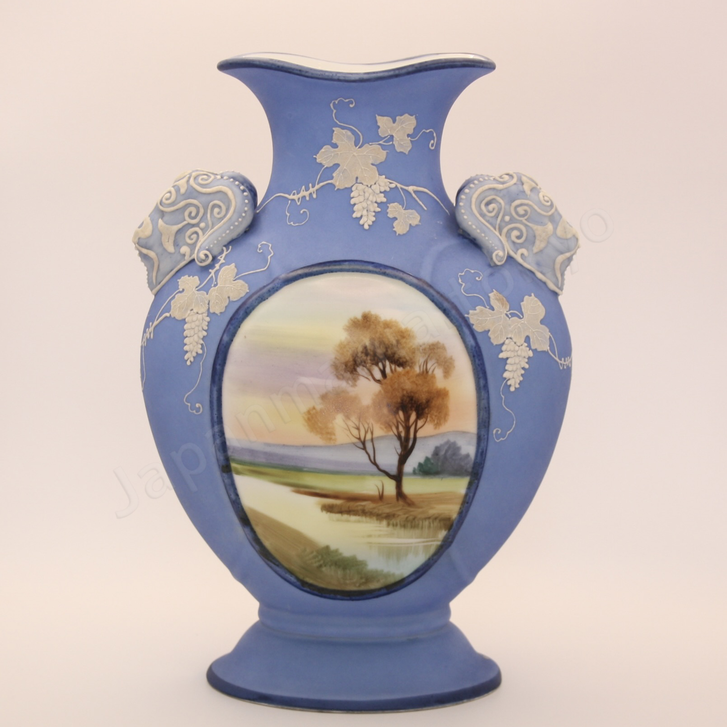 Back view: Japanese antique fine china, Old Noritake.
Vase with handles
Landscape design
Polychrome and while relief (Jasper ware style)
