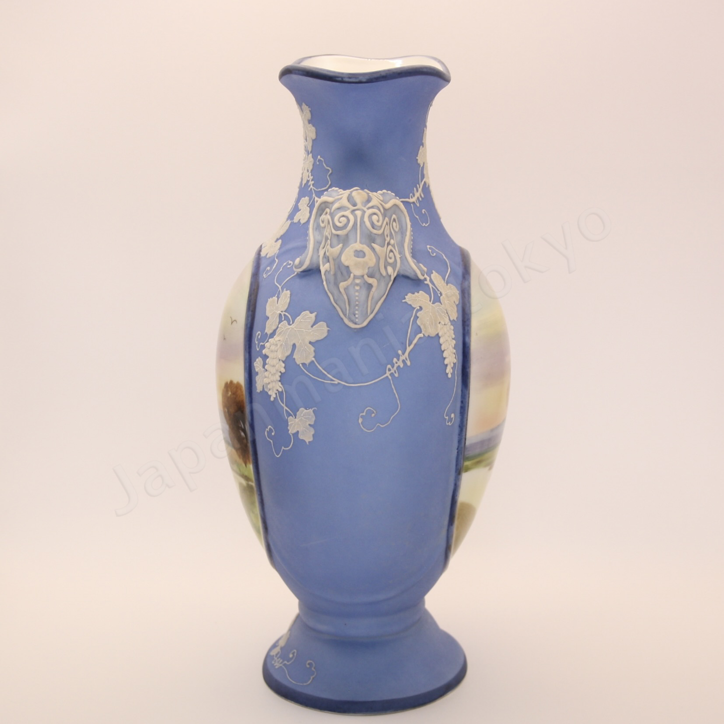 Side view: Japanese antique fine china, Old Noritake.
Vase with handles
Landscape design
Polychrome and while relief (Jasper ware style)