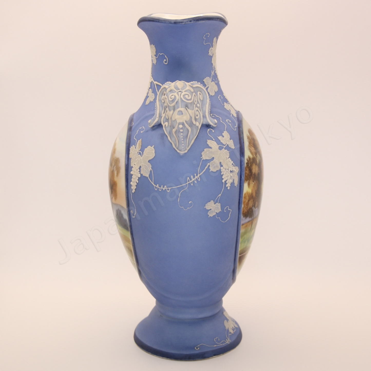 Side view: Japanese antique fine china, Old Noritake.
Vase with handles
Landscape design
Polychrome and while relief (Jasper ware style)